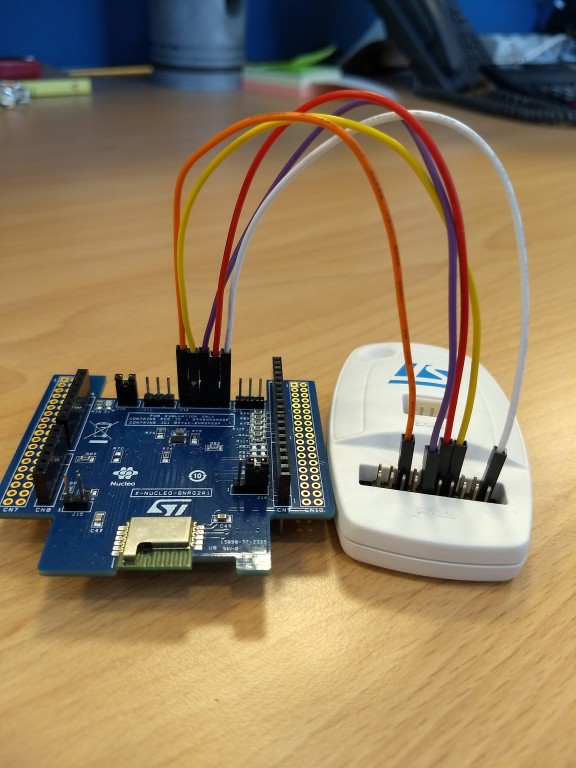 Connection among the J12 pins of the X-NUCLEO-BNRG2A1 and the ST-Link V2-1